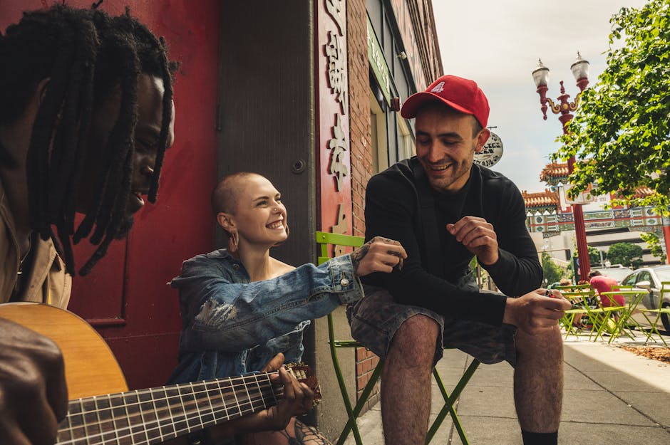 Diverse friends laughing together around a cafe table indoors
