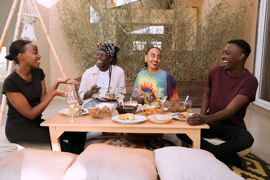Diverse friends laugh together while sharing brunch at a casual table