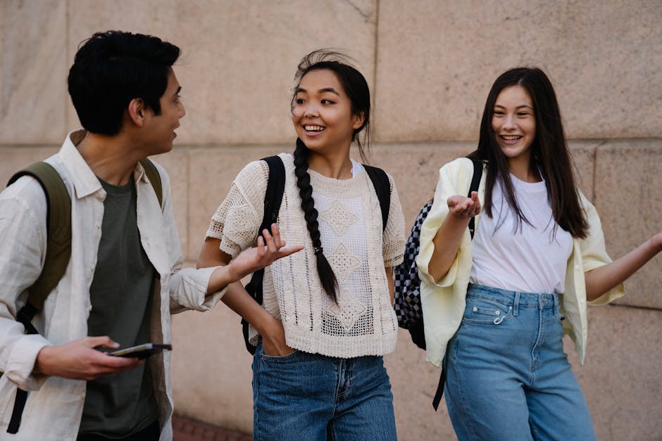 Young adults walking and talking together in an urban park