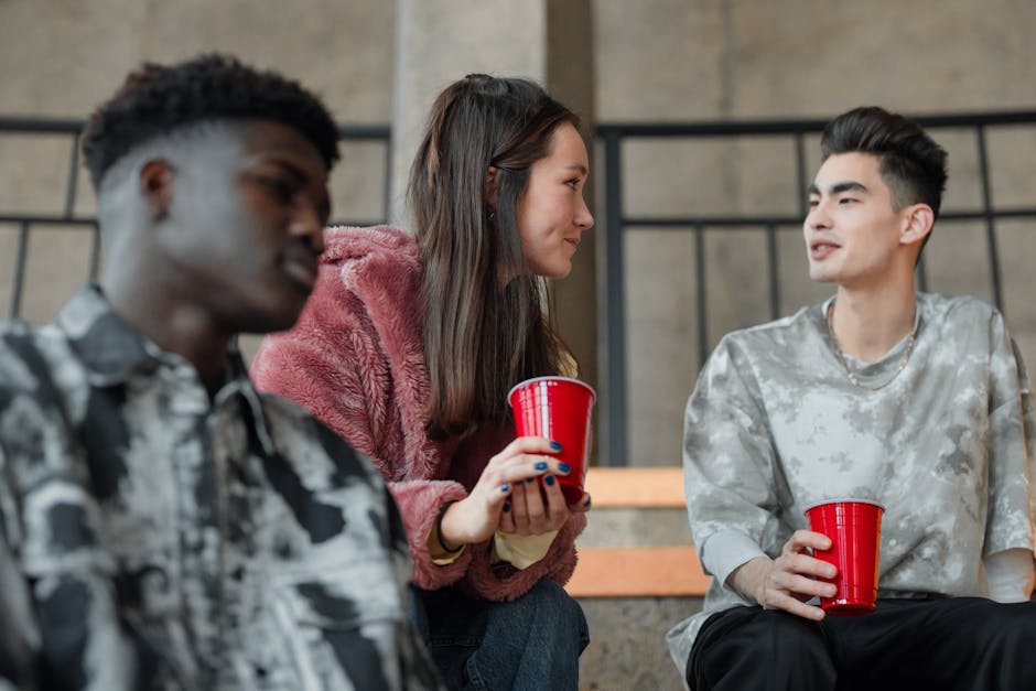 Young friends chatting over brunch on an outdoor terrace
