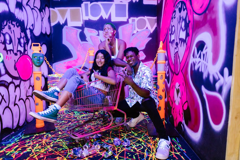 Young adults painting together in a bright art studio workshop setting